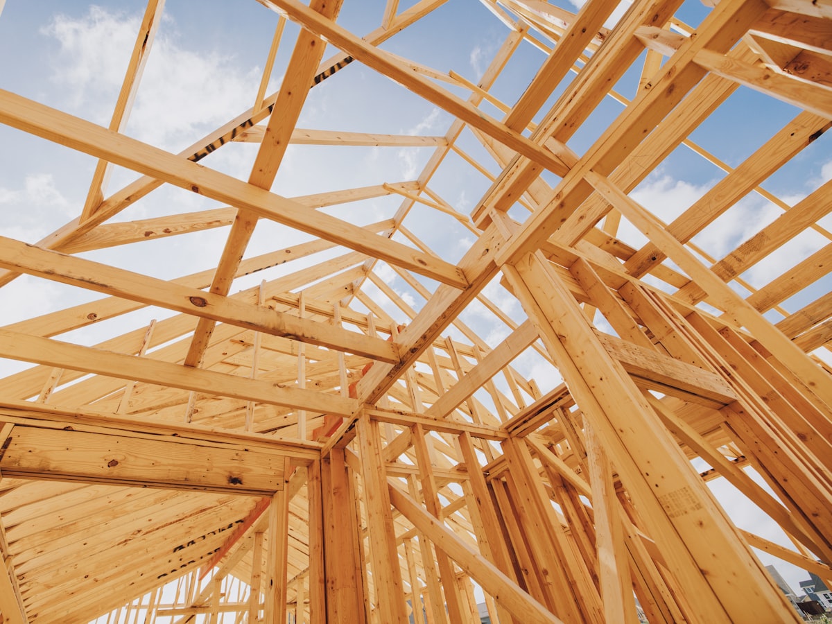 Timber-framed structure of a new build partway through construction