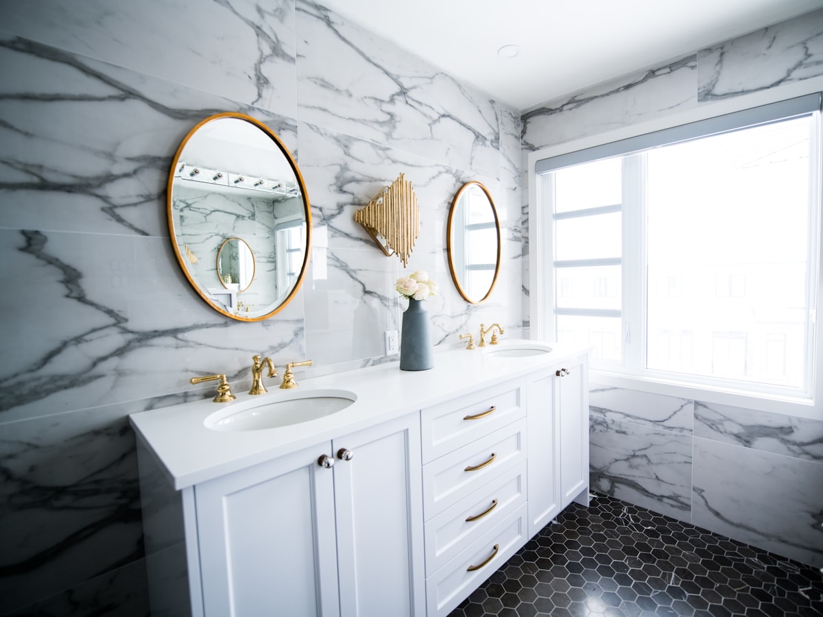 Renovated bathroom with twin basins and a full-width mirror